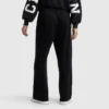 Pantalones Tackle con bajo abierto, C Logo